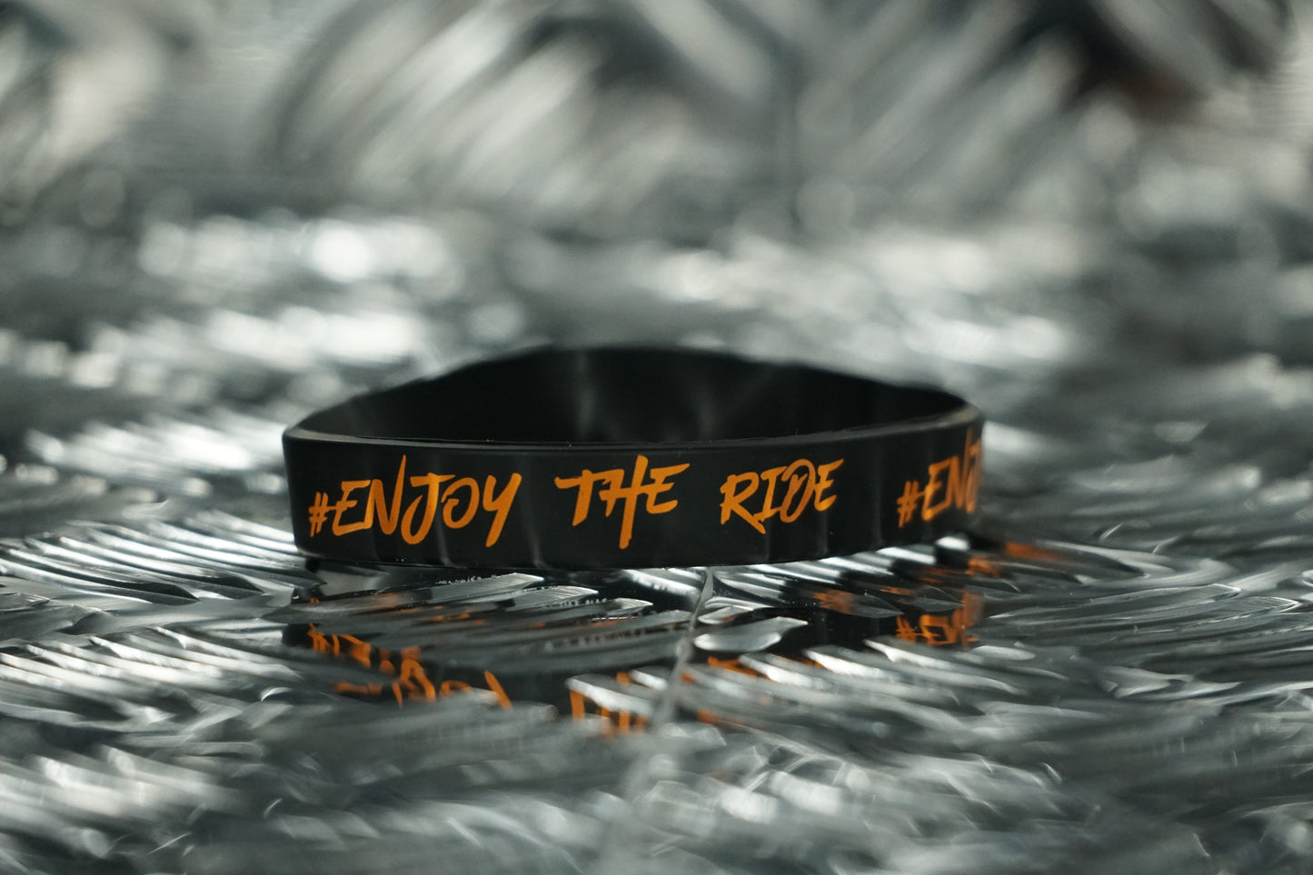 #EnjoyTheRide Black and Orange Wristband